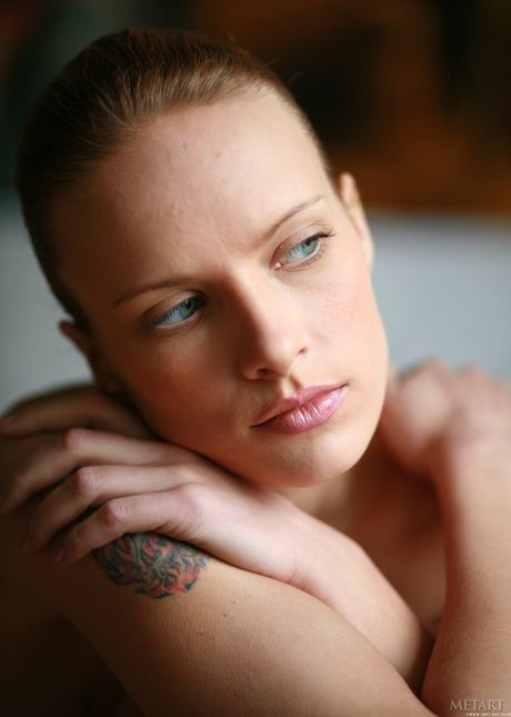 Skinny blonde teen Svea A exhibits her big tits and poses naked