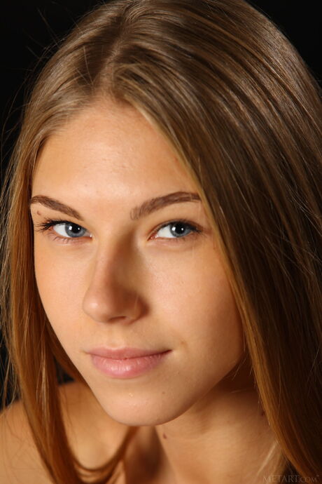 Attractive teen Katherine A removes her lingerie and shows her big tits