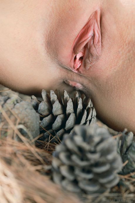 Sexy redhead Violla A poses nude in the forest & reveals her big tits & hot ass