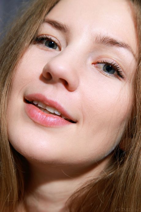 Cute teen Vivian removes her lingerie to pose nude with grace