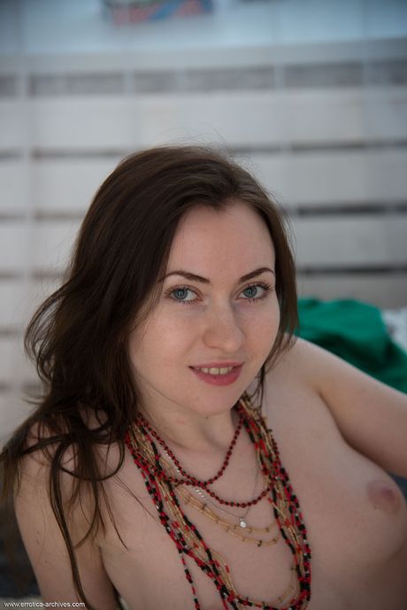 Pure teen Angela H removes her dress and panties to get naked on her bed