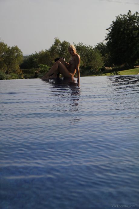 Lesbian girls Tracy Lindsay & Suzie Carina have sex on a poolside patio