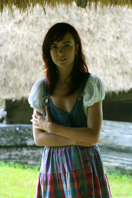 Cute teen Masha F shows her hairy cunt & small tits in a field