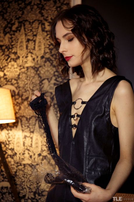 Teen model Poppy gets naked in a pair of black pantyhose during a solo shoot