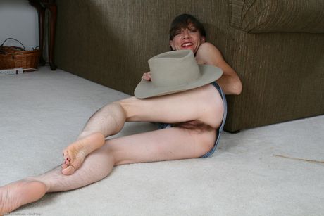 Mature cowgirl Lacy strips and shows her hairy pussy up close