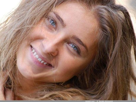 Thin teen Irah poses naked in the forest and shows her tiny tits and ass