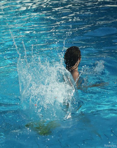 Lean teen Ella Moro strips naked & poses seductively by the pool