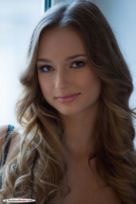 Blonde Ukrainian babe Amy Moore strips and poses naked in the kitchen