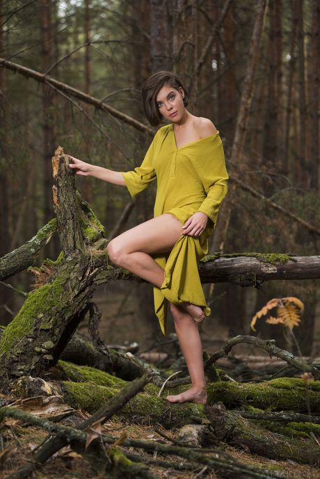 Skinny Ukrainian peach Dakota A strips and poses in the woods