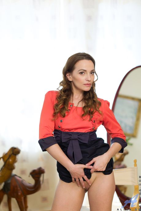 Skinny housewife Alika S shows her shaved pussy up close in a solo