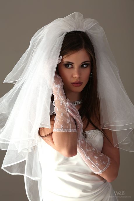 White girl Little Caprice takes off her wedding dress to pose nude in stockings