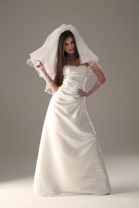 White girl Little Caprice takes off her wedding dress to pose nude in stockings