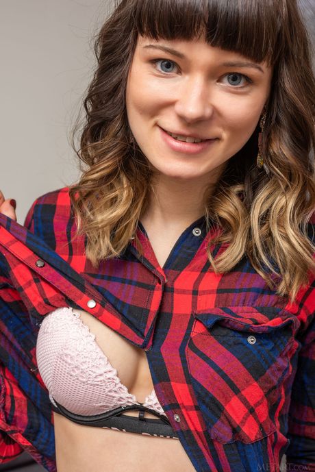 Endearing teen Triste goes nude on a sofa without shyness