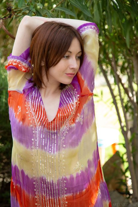 Adorable teen Night A strips off on a garden bench by herself