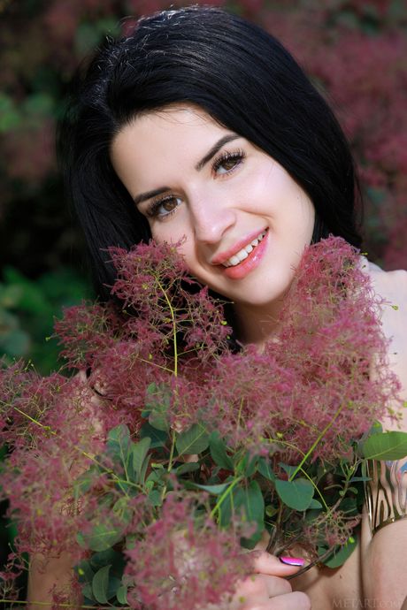 Svelte teen Lola Marron exposes her small tits and poses nude in nature