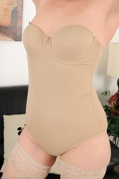 Mature redhead Sable shows her big ass and spreads her pussy in stockings