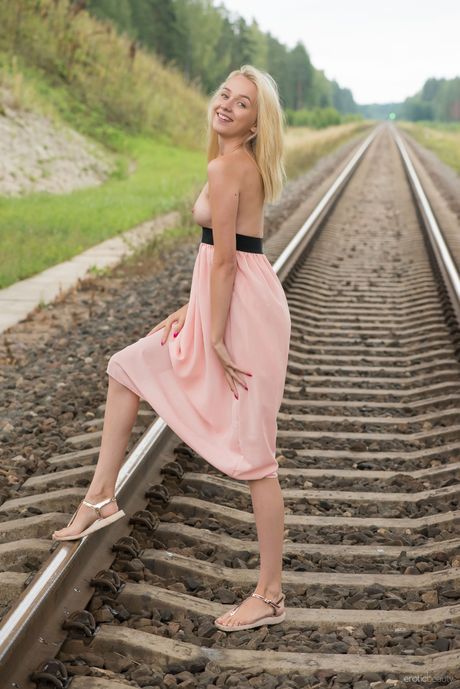 Erotic Beauty: Angelic teen girl with long hair and a great smile models in the nude